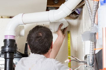 Plumber Determines the Length of a Pipe