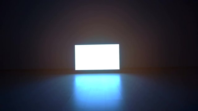 The television with white screen in a dark room