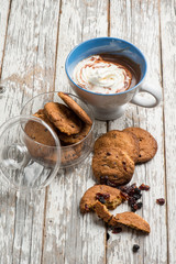 hot chocolate with whipped cream and blueberry cookies