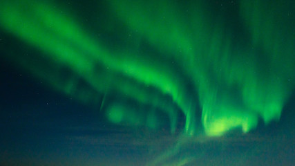 Beautiful stripes of the northern lights, aurora in the night sky.