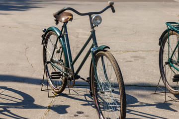 Fototapeta na wymiar Retro bicycle parked on city street