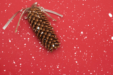 Pinecones on christmas red background.
