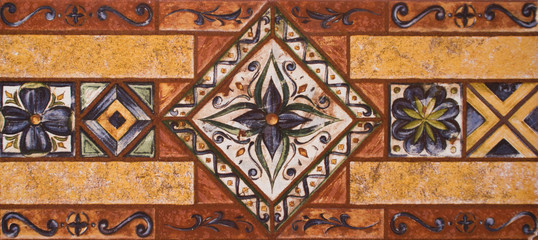 Detail of the traditional tiles from facade of old house. Decorative tiles.Valencian traditional tiles. Floral ornament.