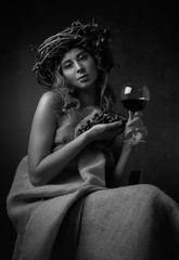  Beautiful girl with glass of red wine .