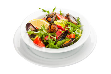 Salad with mussels and chorizo. A traditional Spanish dish. On a white background