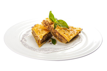 Baklava with walnuts and honey on white background. Jewish, turkish, arabic traditional national dessert