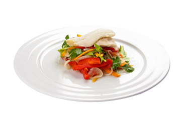 Fillet of sea bass with vegetables on a white background