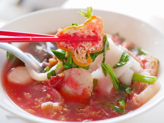 Close up of noodle in pink broth ( Yentafo ) - delicious and healthy street food in Thailand
