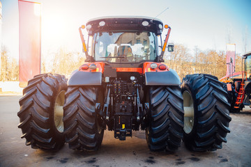 Rear view of modern agricultural tractor. Hydraulic hitch. Hydraulic lifting frame. Rear mechanism...