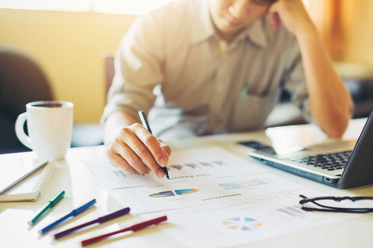 Businessman feeling sad because of suffer loss of money statement from business.Concept picture of fail, financial loss, income deficit, give up and despair.