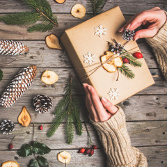 New Year composition of flowers, gifts on a wooden table. Christmas background. Flat lay.Top view