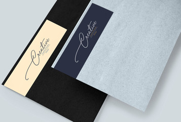 Two creative design envelope mockups