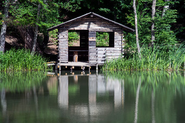 Fototapeta na wymiar Mountain cabin in reflection
