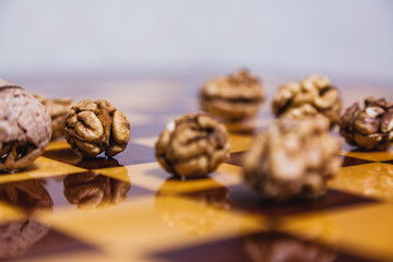 Group of walnut lies on chessboard