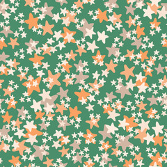Vector seamless pattern with white, orange, beige stars on green background. Fun ditsy star print, constellations and twinkle lights.