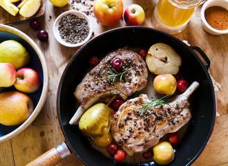 Pork chop with apples in a pan food photography recipe idea