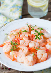 boiled shrimps on wooden surface