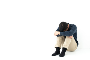 sad person sitting on white background