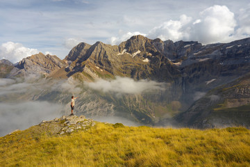 Showing tourist on the ridge with mountains on backround, Pyrenees
