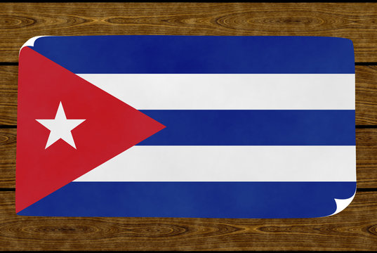 Illustration of a Cuban flag painted on the papier pasted on the woody wall