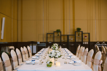 Table setting at a luxury wedding reception.