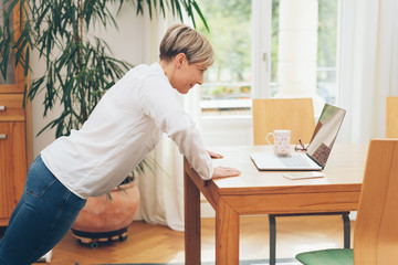 Fit businesswoman doing stretching exercises