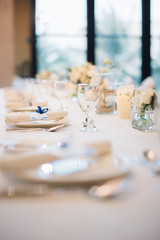 Table setting at a luxury wedding reception.