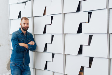 Man in jeans clothing with his arms crossed