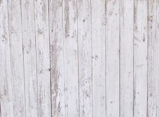 Obraz premium fencing of boards with peeling white paint, background