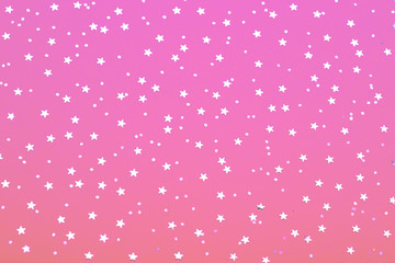 Christmas pattern made of silver stars on blue background. Winter concept. Flat lay.