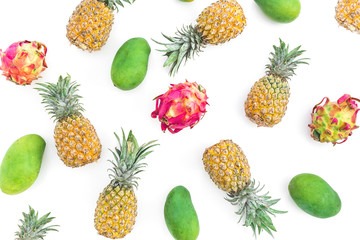 Fruit pattern with pineapple, mango and dragon fruits on white background. Flat lay, top view. Food background.