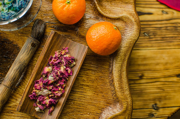 Organic blue tea Anchan in a teapot and a cups on wooden background