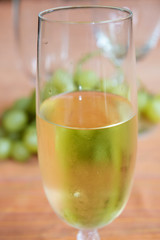 grape-harvest time. White wine and bunch of grapes
