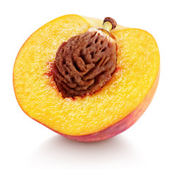 Ripe half peach fruit with nut isolated on white background with clipping path. Full depth of field.