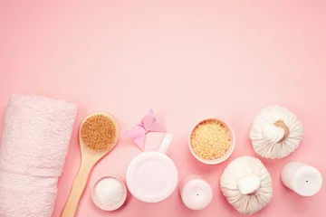 Keuken spatwand met foto Feminine beauty and spa products, tools and cosmetics over the pink background © netrun78