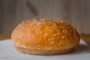 Freshly Baked Burger Bun with Sesame Dressing.