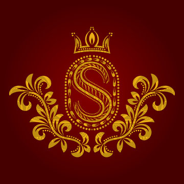 Patterned golden letter S monogram in vintage style. Heraldic coat of arms. Baroque logo template.