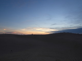 Silhouette Style Sunrise at the Big Sand Dune in Mui Ne City, Travel in Vietnam in 2012 December 7th.