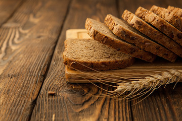 sliced grain bread on a wooden Board