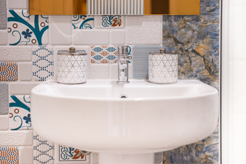 Bathroom interior with sink and faucet.
