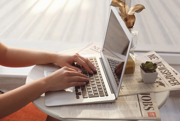 Woman using laptop on table