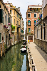 Venice in northern Italy is made up of 118 small islands separated by canals and bridges. This is just one of those canals with residential homes almost touching each other. 