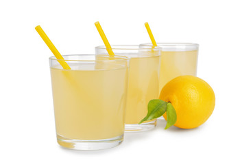 Glasses of cool tasty lemonade on white background