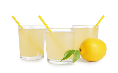 Glasses of cool tasty lemonade on white background