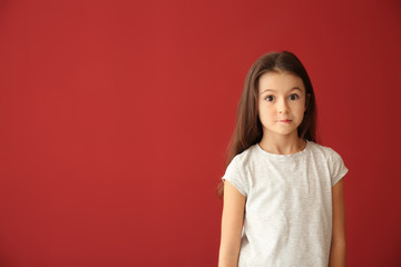Emotional girl after making mistake on color background