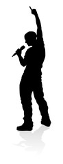 A singer pop, country music, rock star or hiphop rapper artist vocalist singing in silhouette