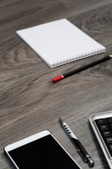 Business objects on a wood desk.
