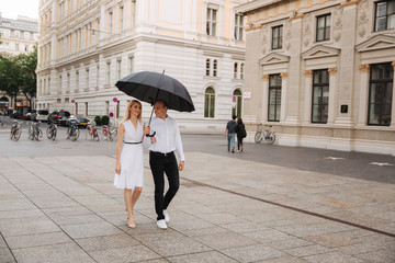 Lovely couple walking around the city. During the summer