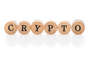 Word Crypto from circular wooden tiles with letters children toy.