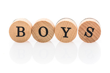Word Boys from circular wooden tiles with letters children toy.